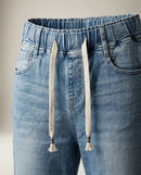 Blugi de damă cu talie elastică și șnur, model conic din denim prespălat, ideali pentru ținute casual-moderne
