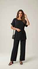 Compleu elegant negru de damă din două piese, cu top lejer cu cordon în talie și pantaloni largi, ținută versatilă casual-chic