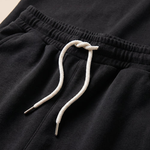Fustă-pantaloni mini cu șnur, neagră — detaliu material