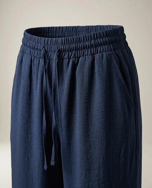 Pantaloni damă bleumarin cu talie elastică si snur, model lejer din material fluid, stil casual-elegant