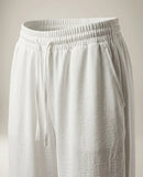 Pantaloni de damă albi lejeri cu talie elastică și șnur, model cu picior drept, ideali pentru ținute casual de vară