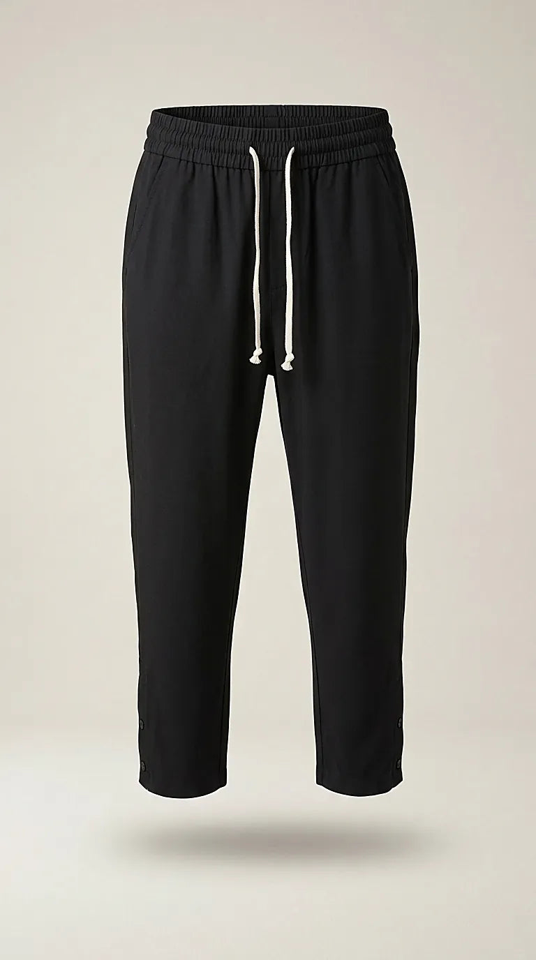 Pantaloni jogger negri de damă cu talie elastică și șnur alb, model casual relaxed fit, perfecți pentru ținute lejere de zi