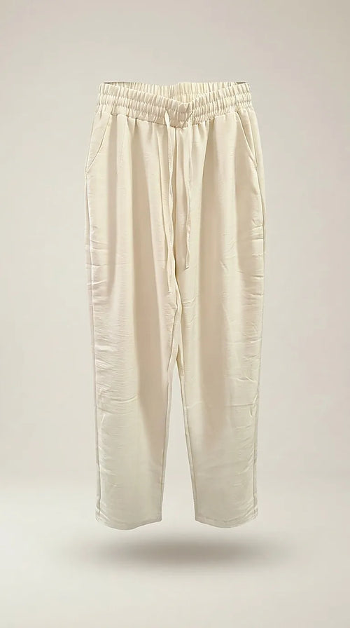 Pantaloni lungi de damă crem cu talie elastică și șnur, model casual-elegant din material fluid