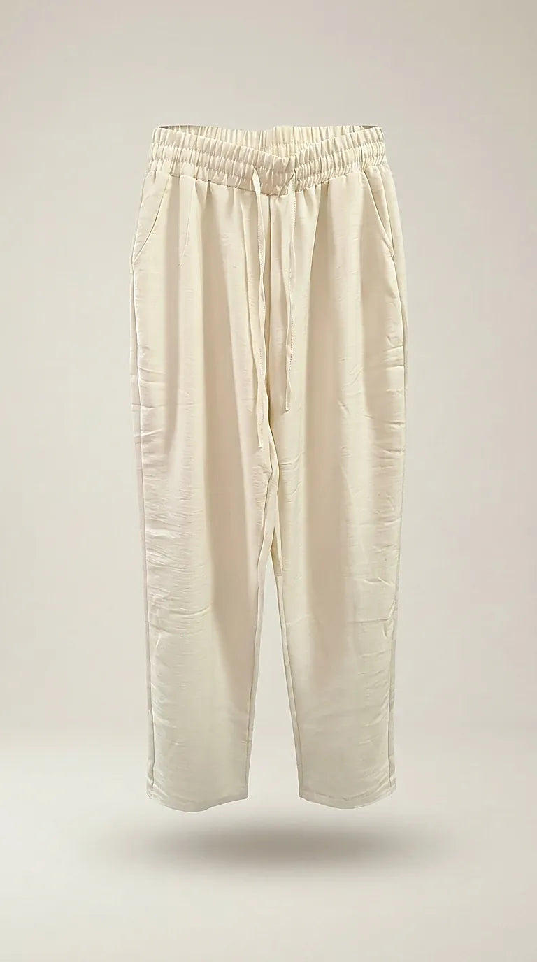 Pantaloni lungi de damă crem cu talie elastică și șnur, model casual-elegant din material fluid
