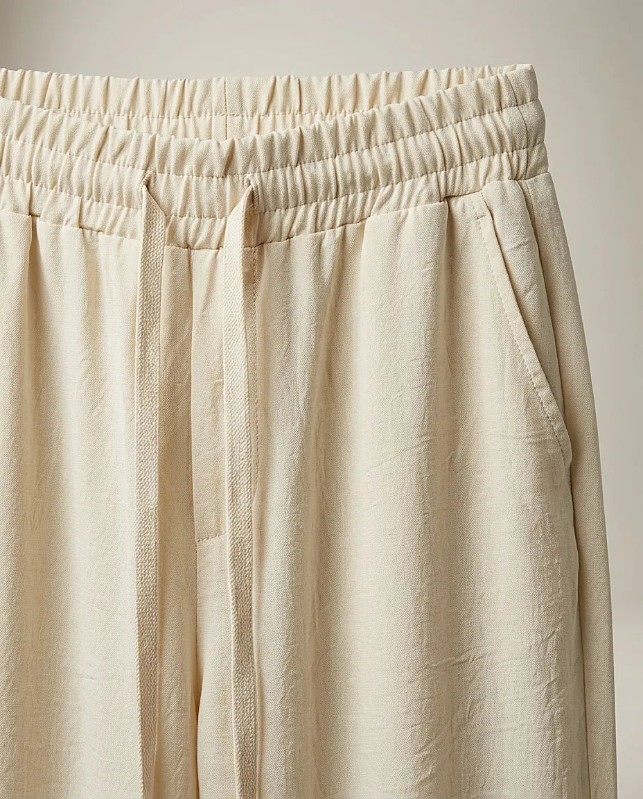 Pantaloni lungi de damă crem cu talie elastică și șnur, model casual-elegant din material fluid