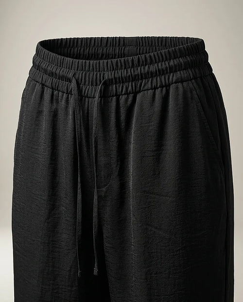 Pantaloni negri de damă cu talie elastică și șnur, croială dreaptă, lejeri și eleganți, perfecți pentru ținute casual-chic