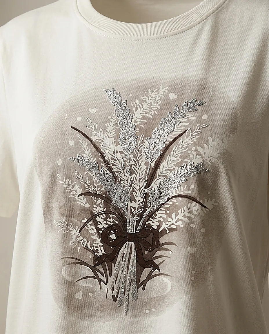 Tricou alb din bumbac pentru femei cu imprimeu floral stilizat cu sclipici, mânecă scurtă și decolteu rotund